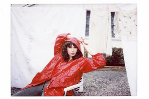 Grace Mitchell in Red Rain Coat