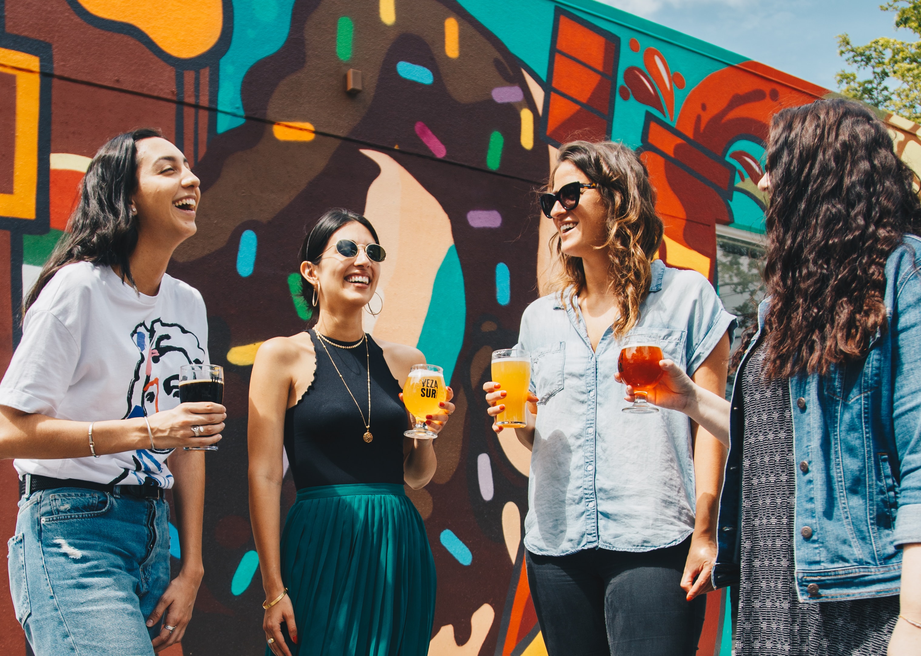 Young People smiling and drinking martinis