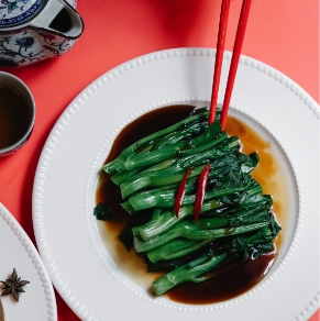 dark green vegetables on red background